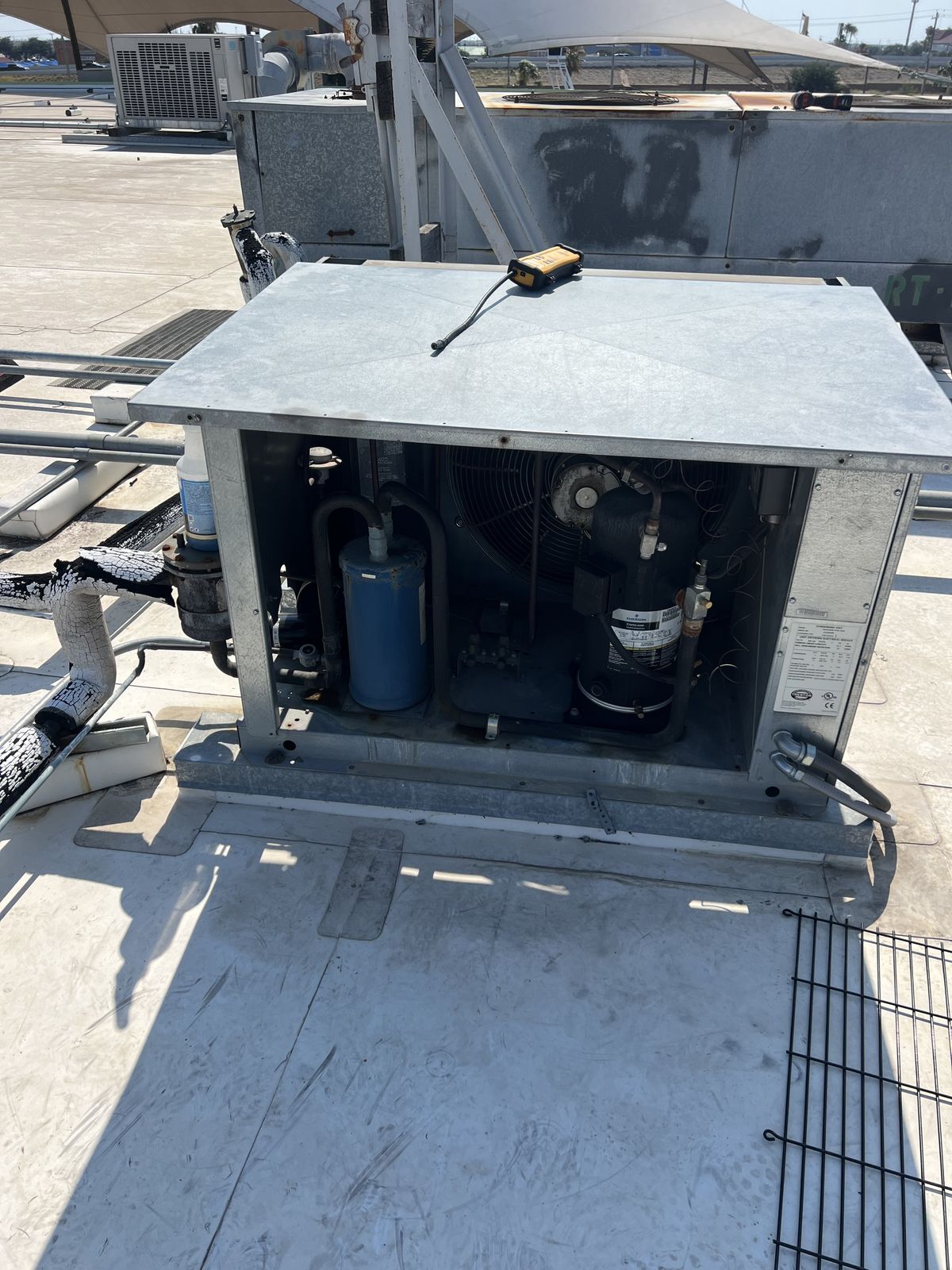 Top view of a commercial rooftop HVAC condenser unit